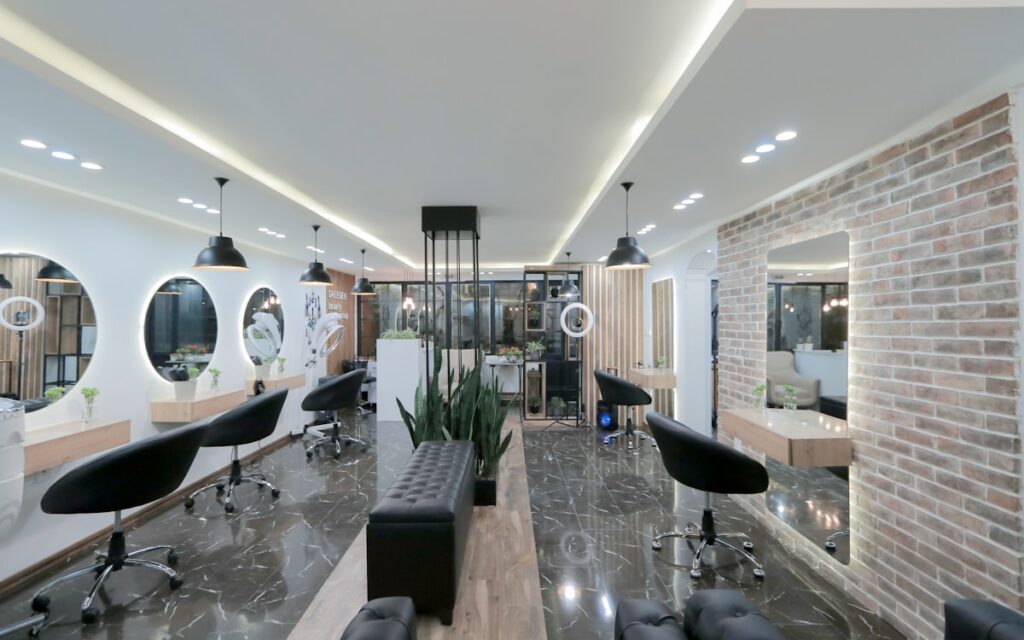A large modern salon floor with multiple styling stations