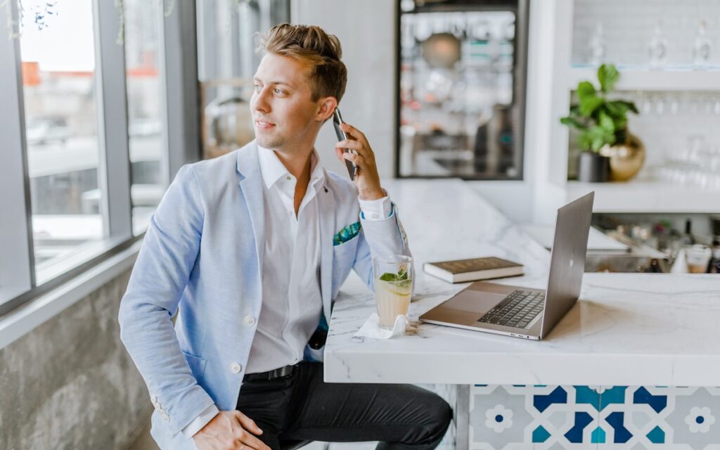 Salon owner taking a booking on a mobile phone